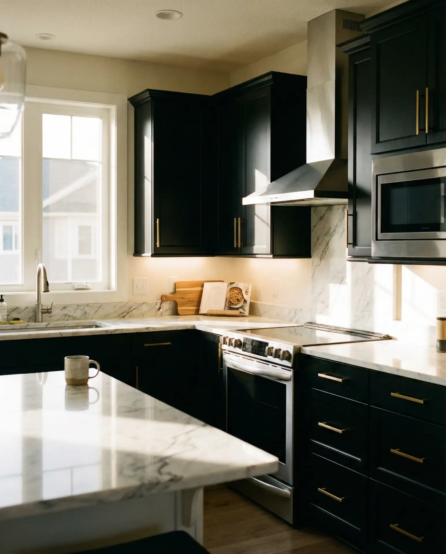 Black Cabinets with White Countertops and Gold Hardware 2