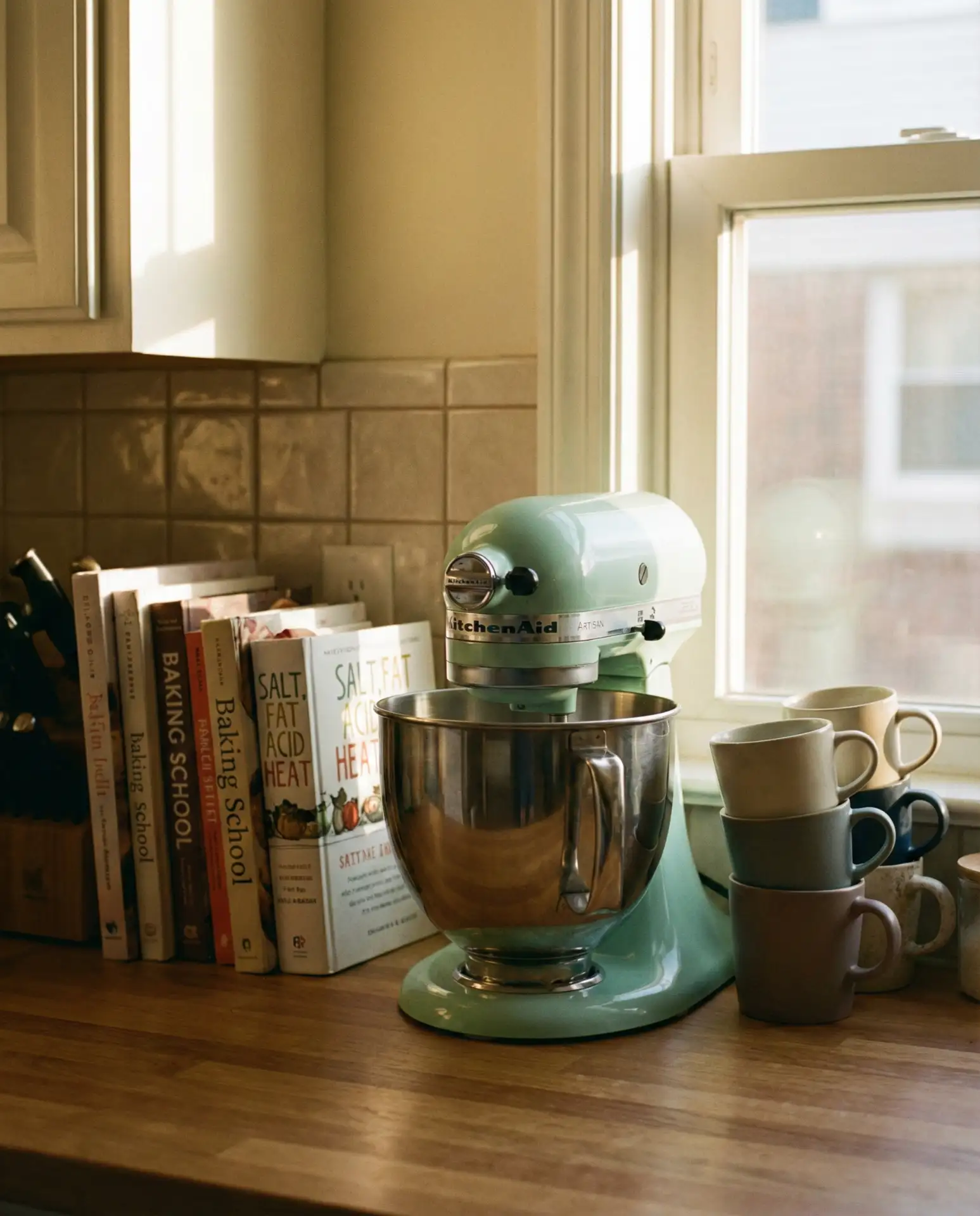 Coffee Station with Stacked Cookbooks and a Kitchenaid Mixer 1