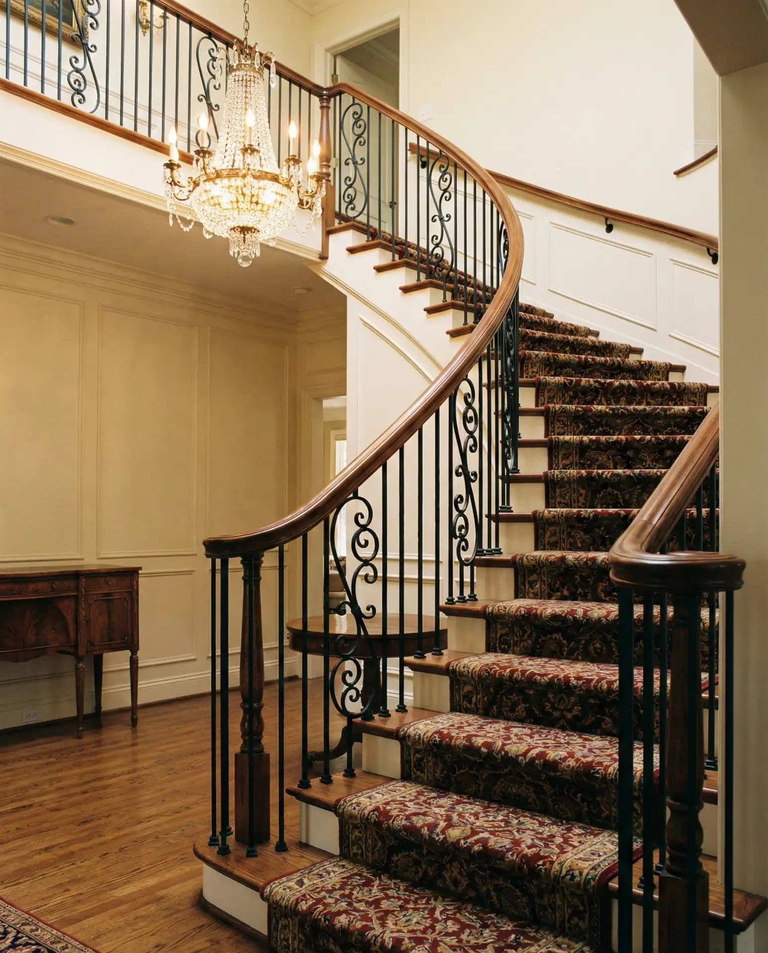 Curved Staircase with Wrought Iron Balusters 1