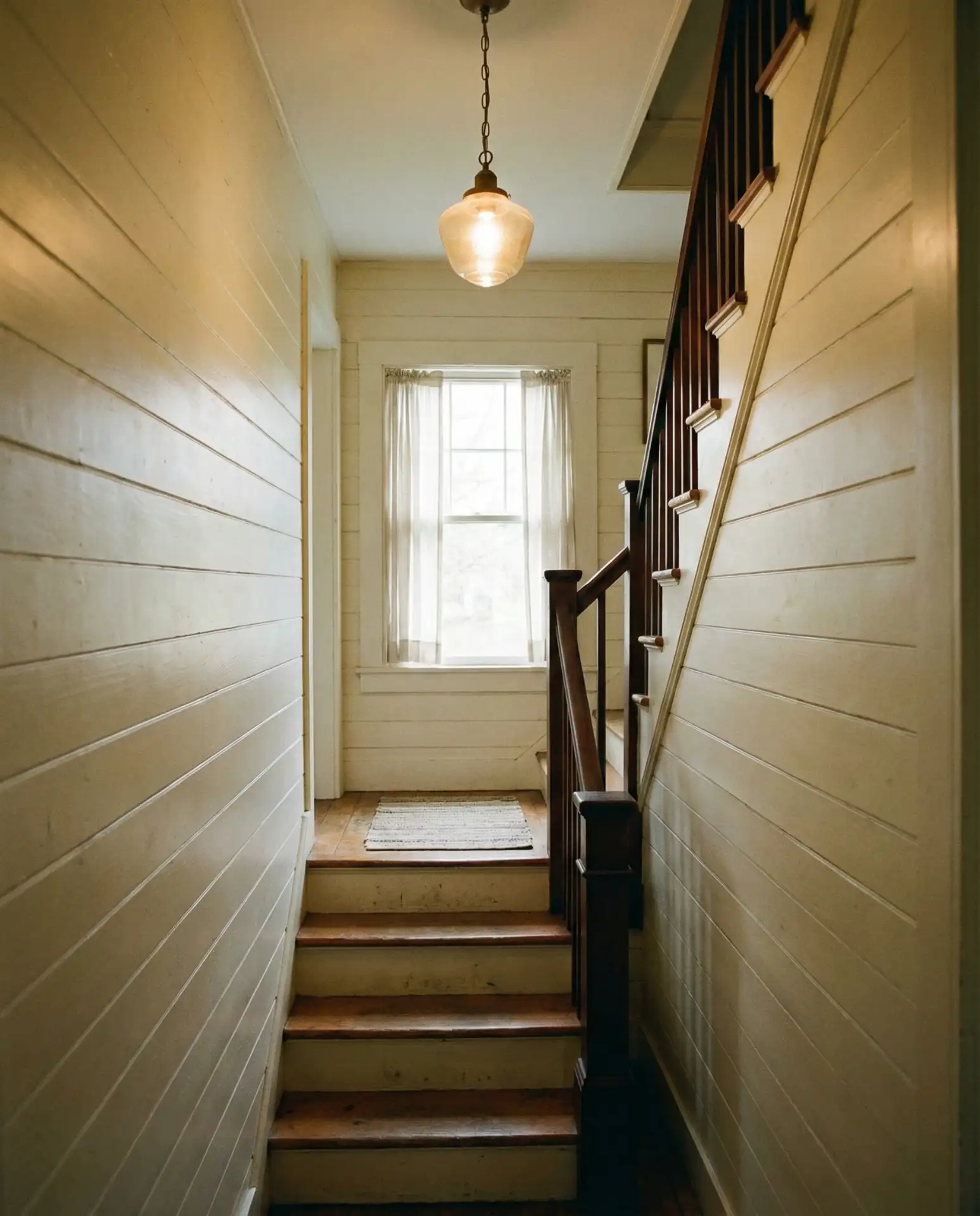 Enclosed Staircase with Paneled Wainscoting 1