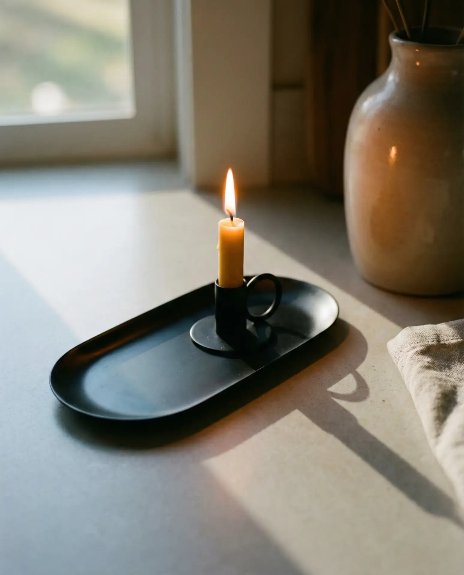 Minimal Black Tray with a Single Candle 2