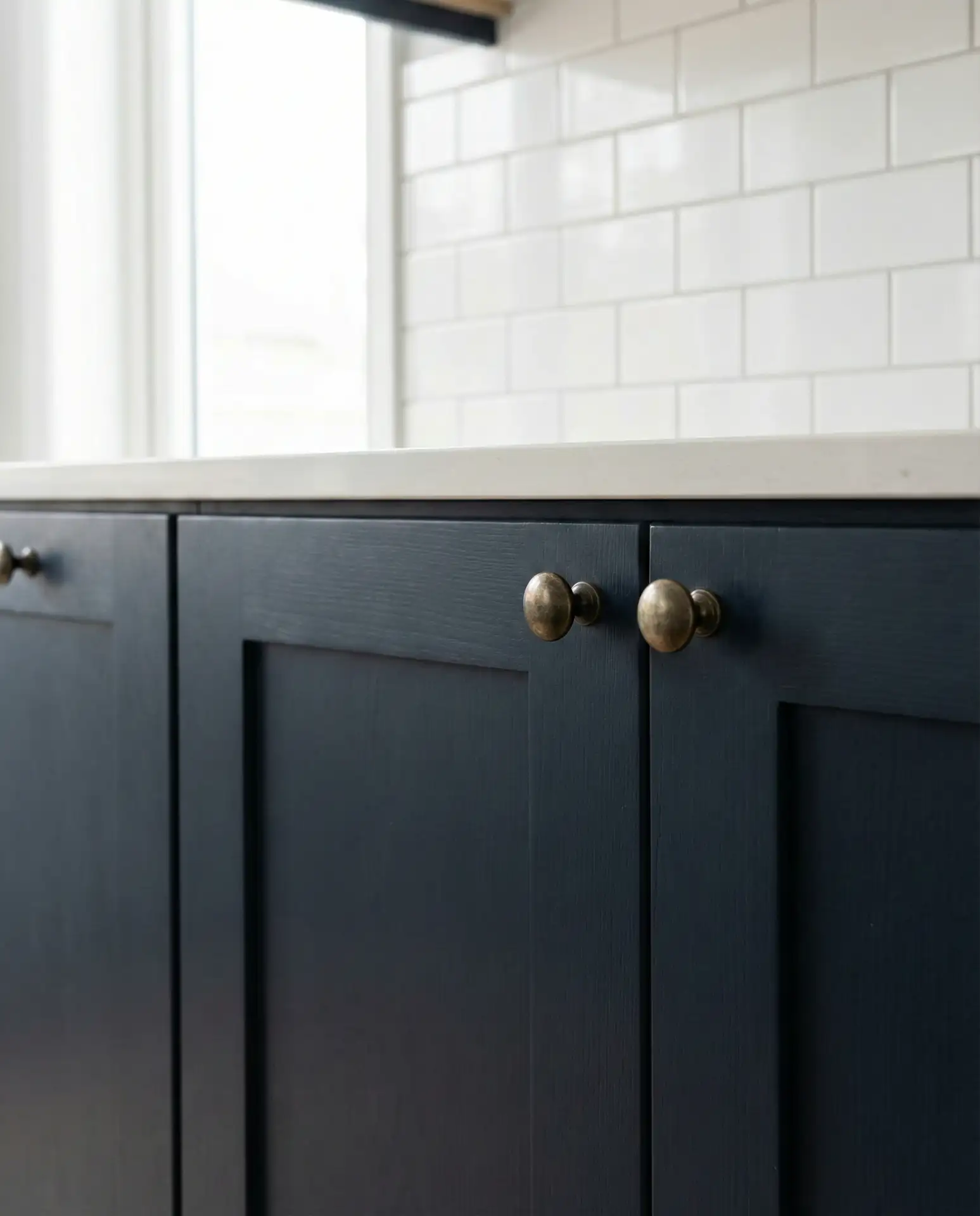 Navy Blue Shaker Cabinets with Brass Hardware 1