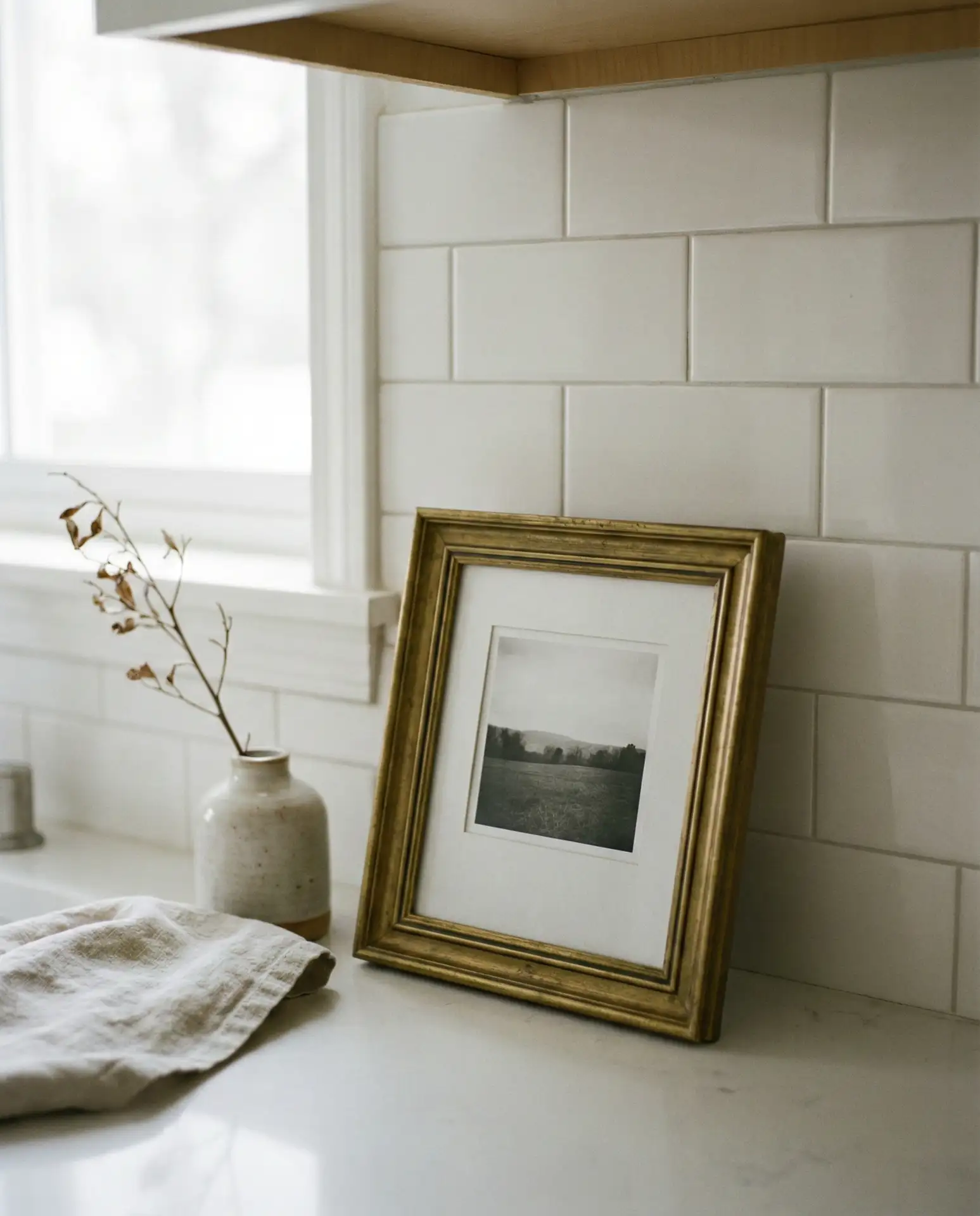 Picture Frame Leaning Against Backsplash 2