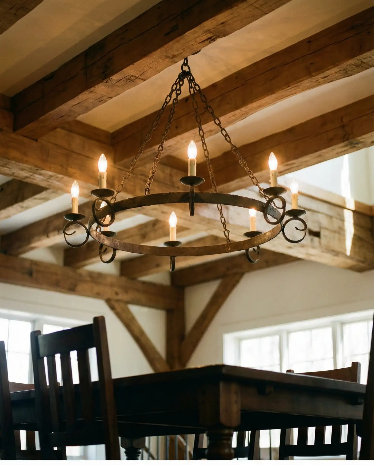 Wrought Iron Chandeliers Over Dining Tables 1