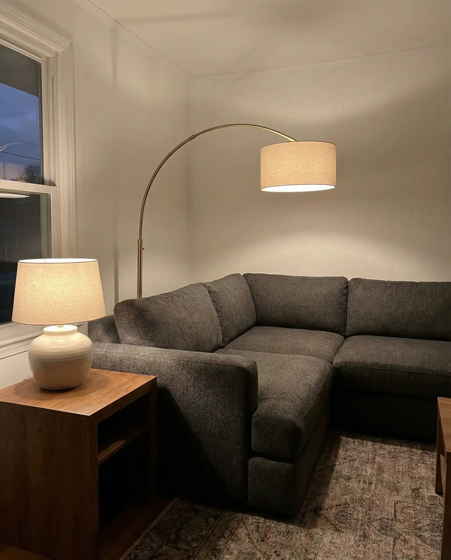 Grey Couch with Layered Lamp Lighting 1