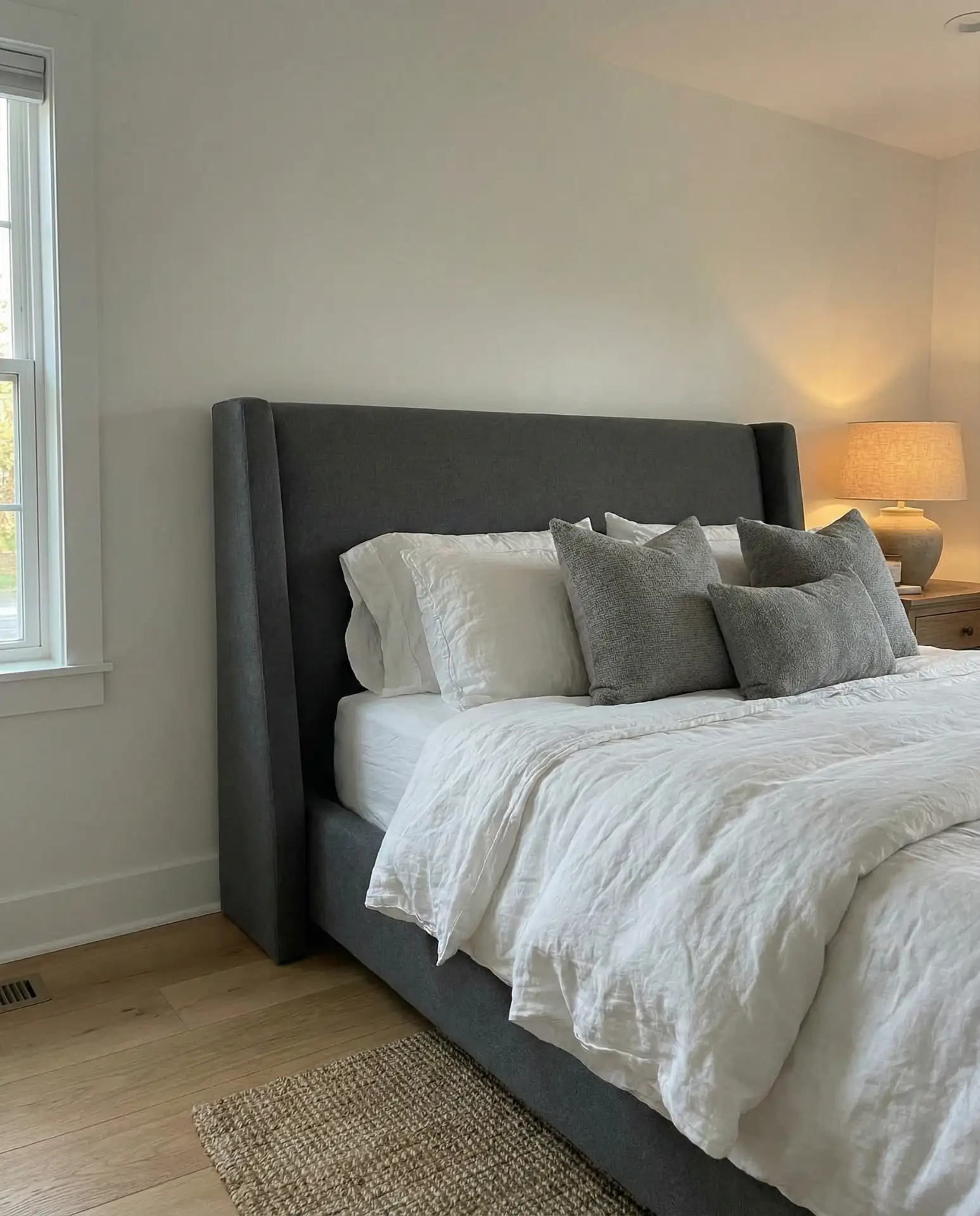Grey Headboard with Soft White Walls 1