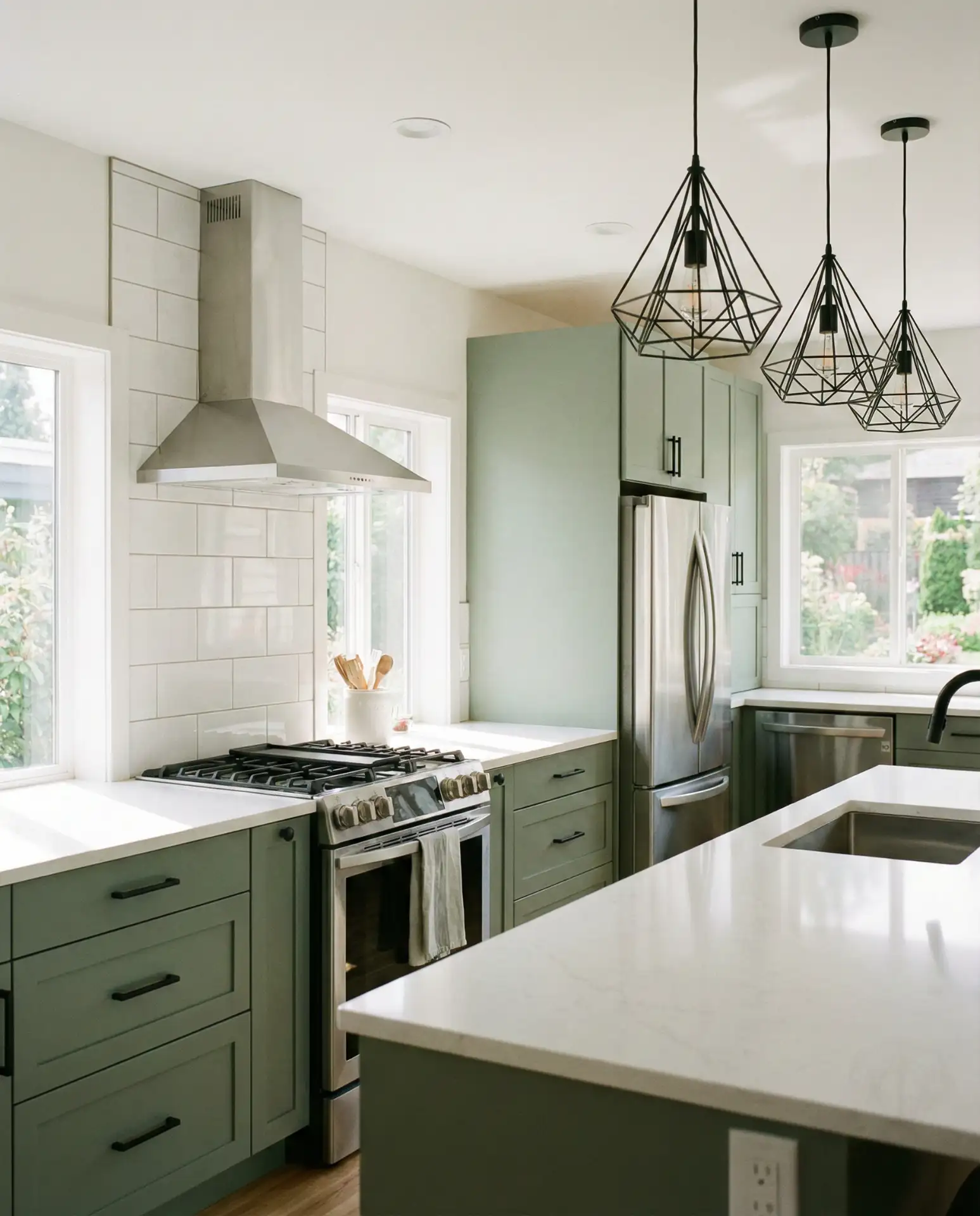 Modern Sage Green Kitchen with Sleek Hardware 1