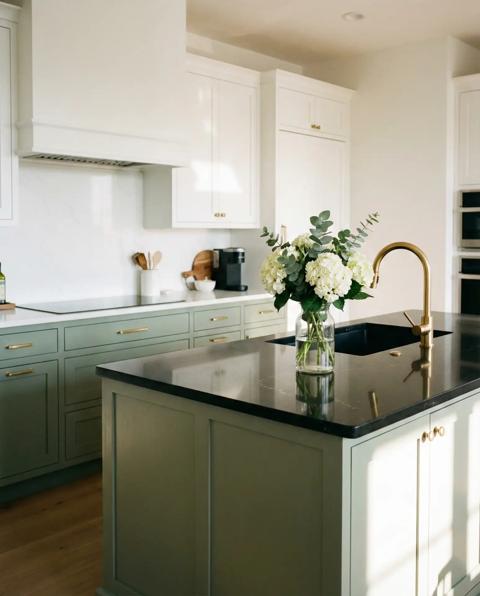 Sage Green Cabinets with Black Countertops and Gold Fixtures 1