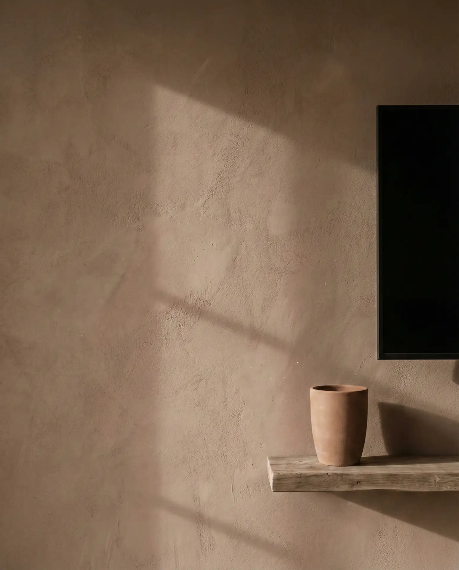 Textured Plaster TV Wall in Earthy Tones 1