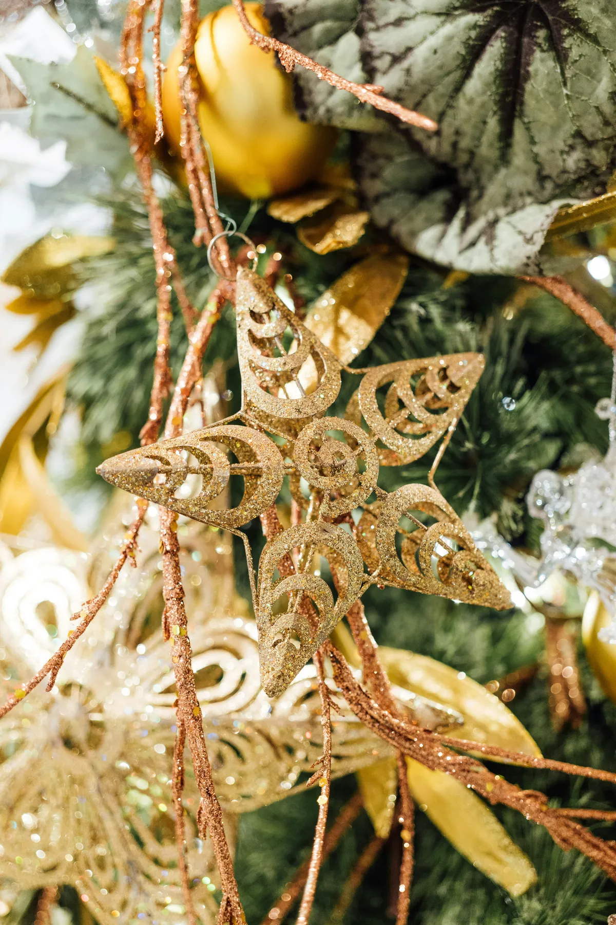 a close up of a christmas tree with ornaments
