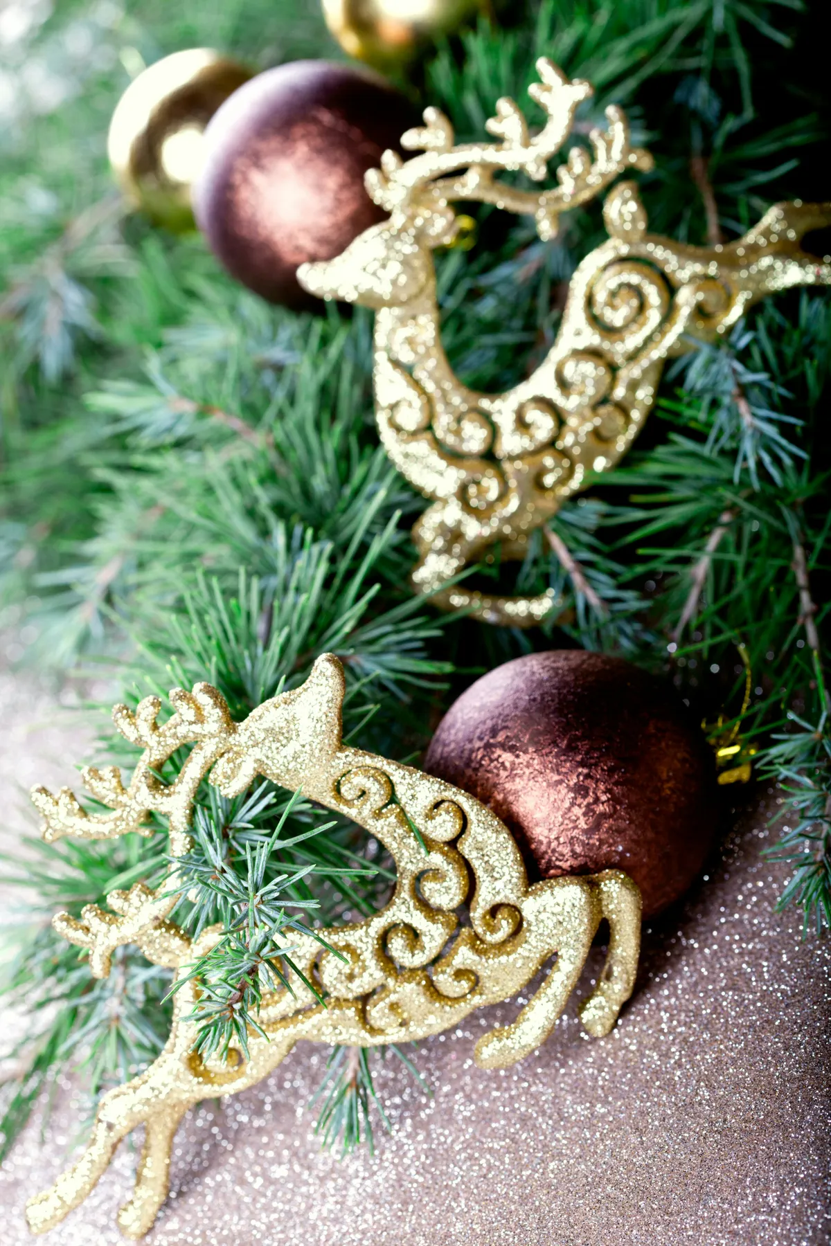 A couple of ornaments sitting on top of a tree