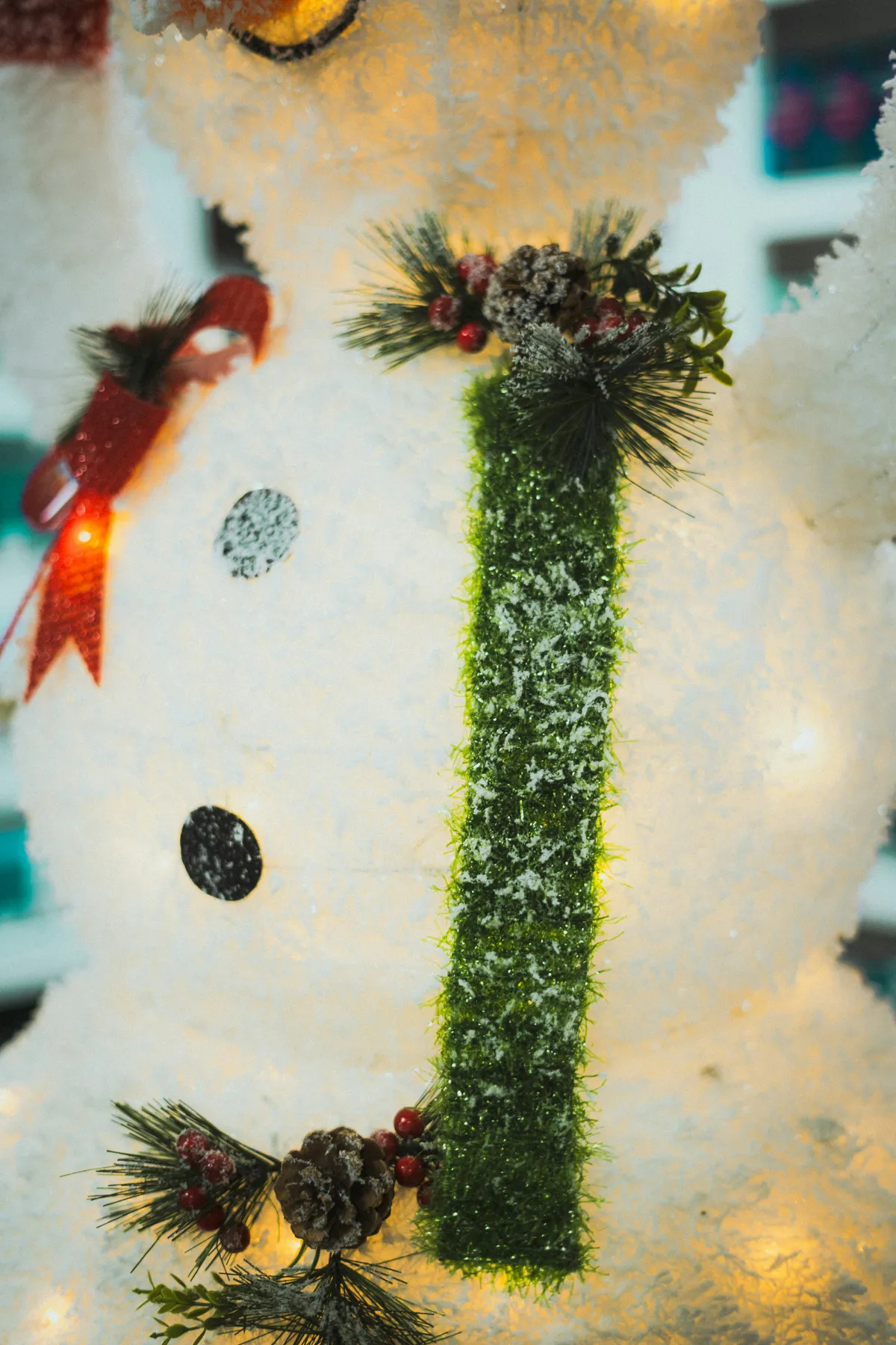 A decorative snowman with festive winter accents