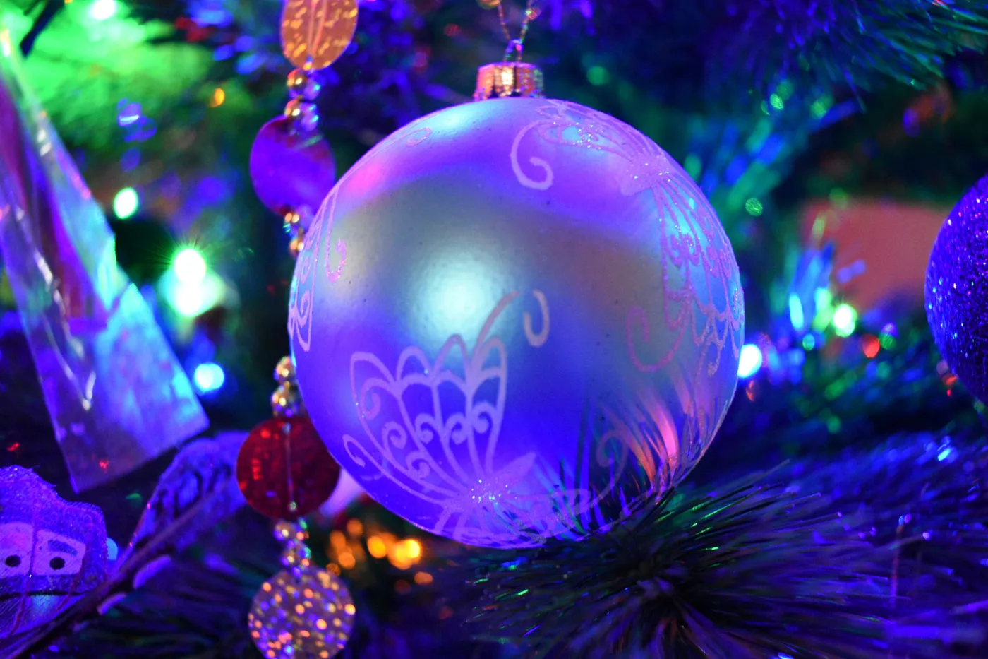 Close-up of a blue christmas ornament with lights