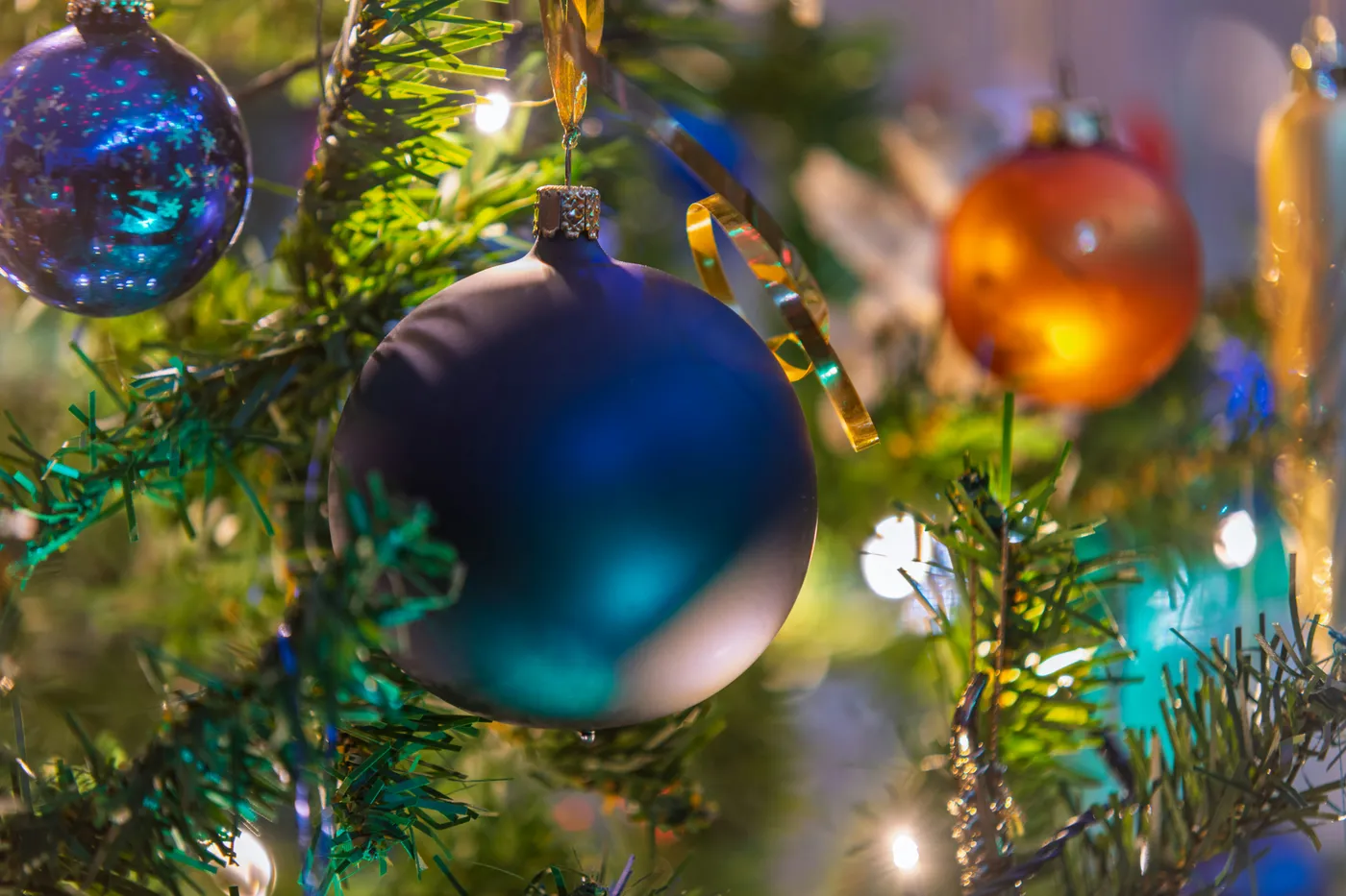 Close-up of colorful christmas ornaments on a tree