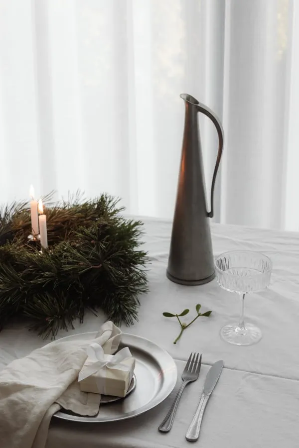 Close Up White Wrapped Gift with Silver Plate, Cutlery and Mistletoe  Branch. Ideal for christmas and xmas projects. Free for commercial use.