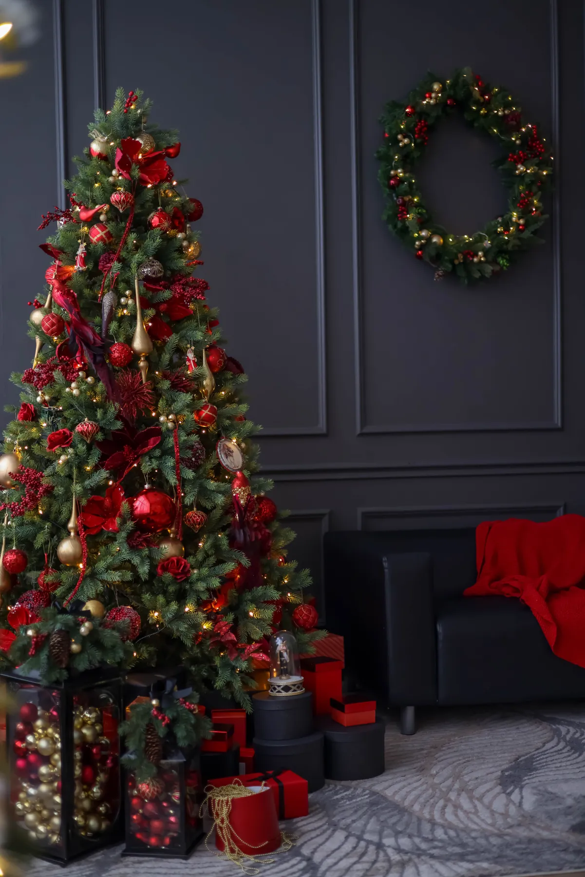 Festive living room with a beautifully decorated Christmas tree and presents.