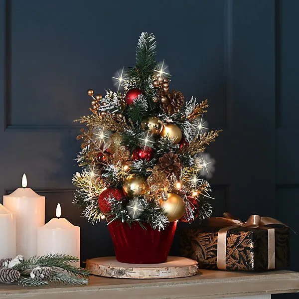 Mini 41cm Artificial Christmas Tree. Red, Gold & Green decorated snowy  branches- 30 warm white LEDs. Baubles, ribbon & pinecones