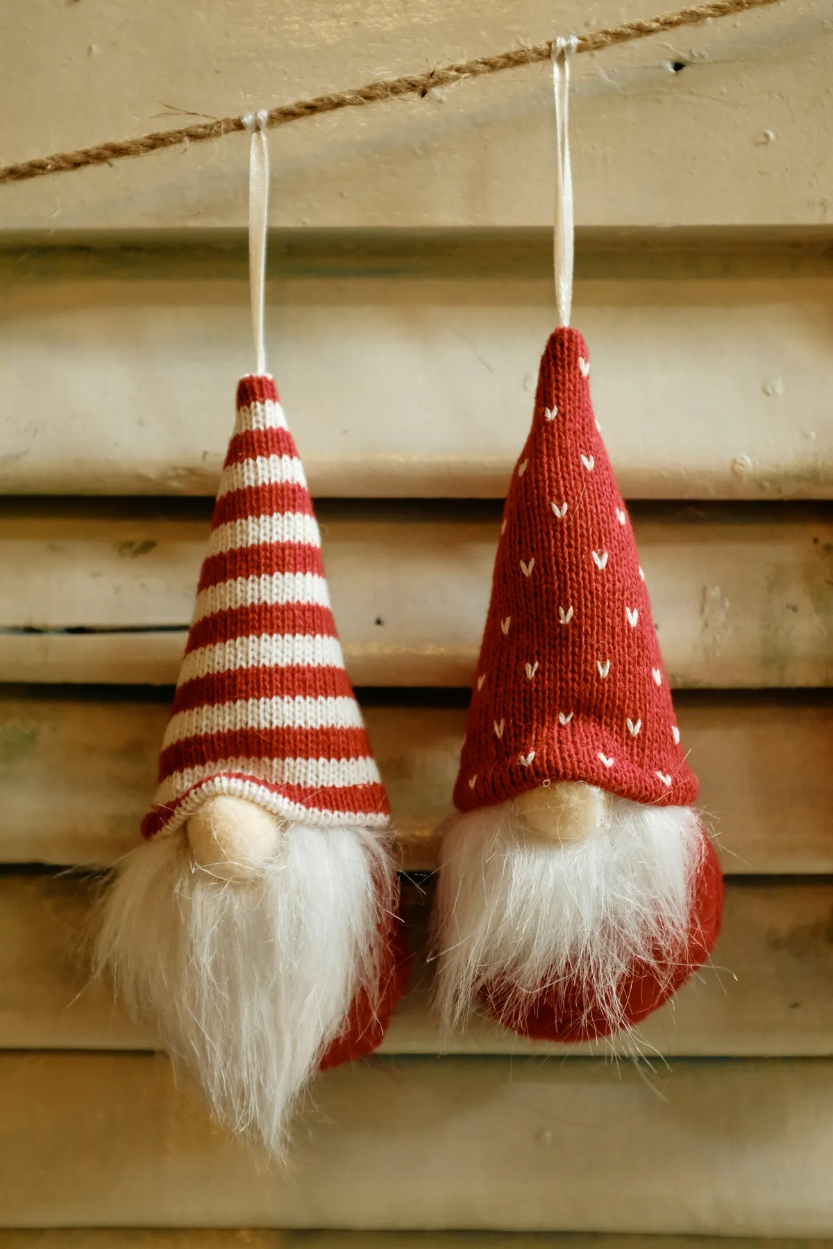 Two christmas gnomes hanging on a string