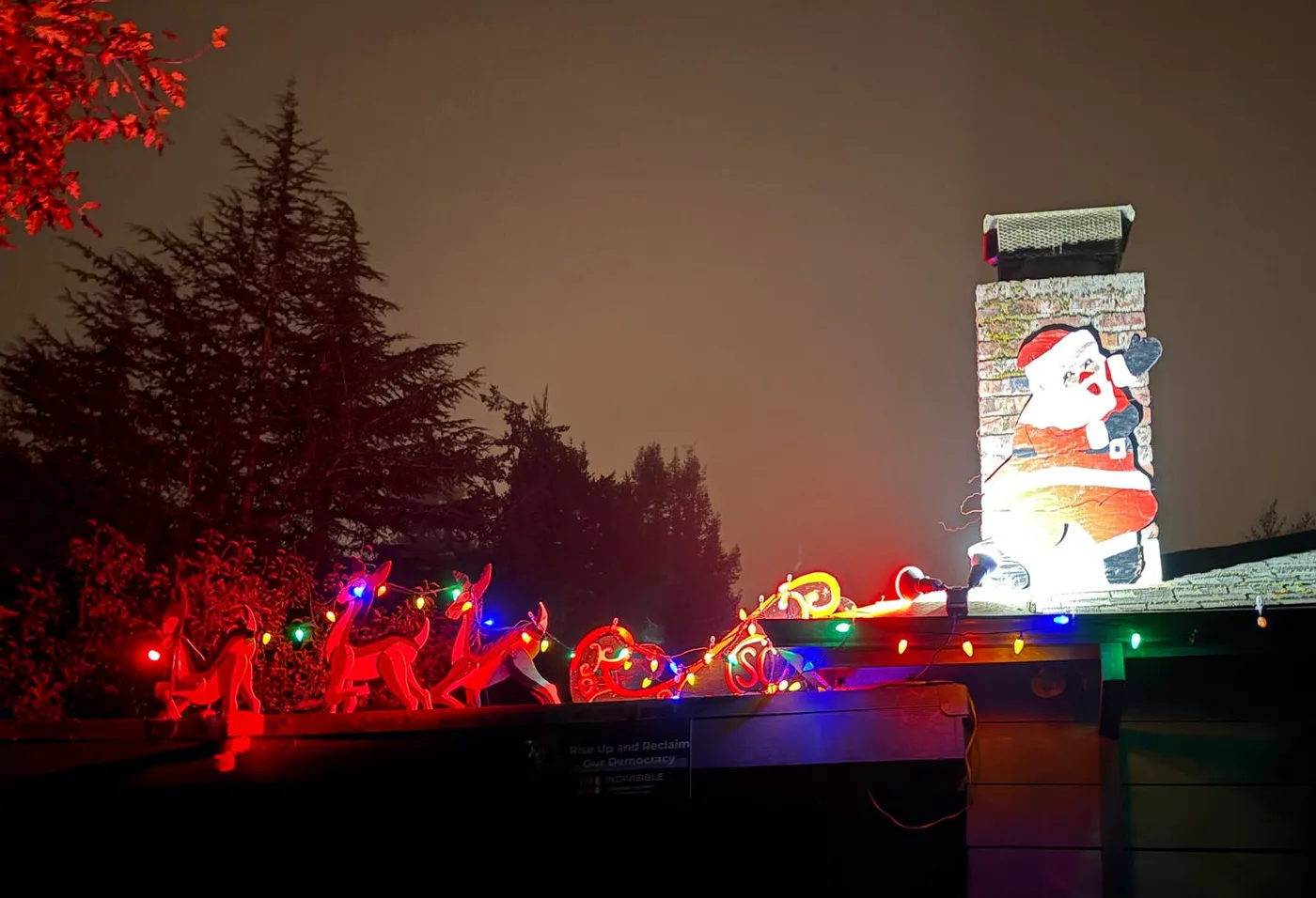 Up on the rooftop, reindeers pause, out jumps good ol' Santa Claus